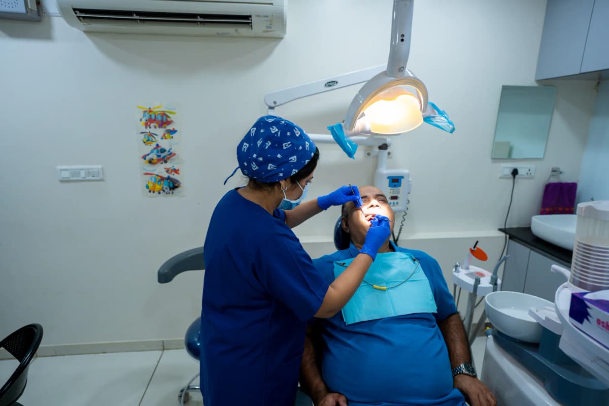 Dental treatment taking place in the clinic treatment room