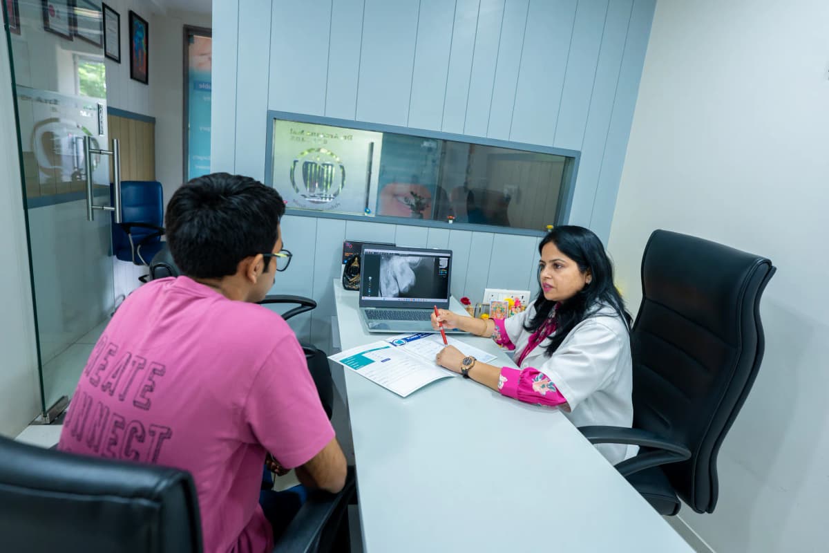 A patient discussing dental care with the dentist